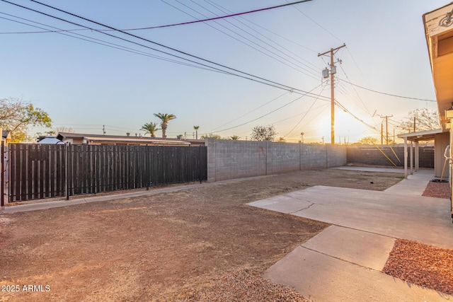 view of yard featuring a patio area and a fenced backyard