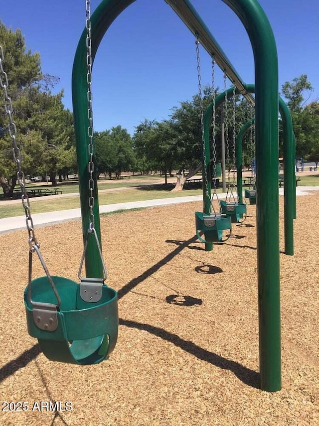 view of home's community featuring playground community