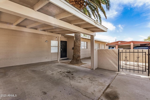 view of patio / terrace featuring a gate and fence