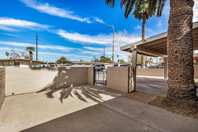 view of gate featuring fence