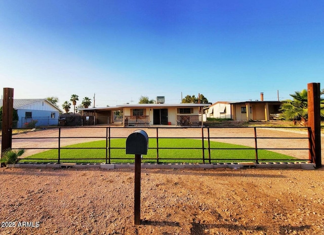 single story home featuring a front lawn