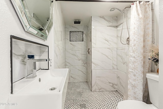 bathroom with walk in shower and toilet