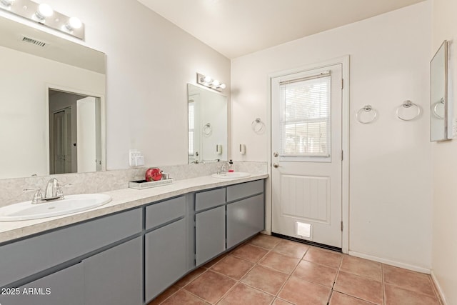 bathroom with tile patterned flooring and vanity