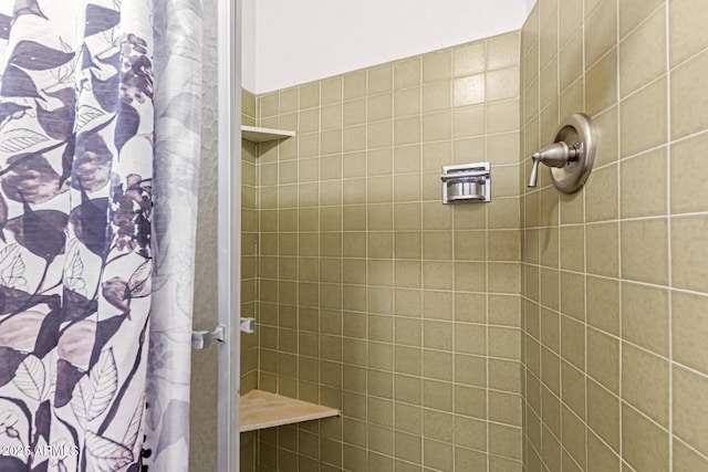 bathroom featuring curtained shower