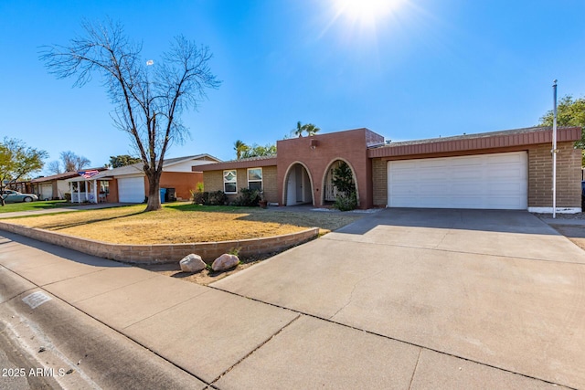 view of front facade with a garage and a front yard