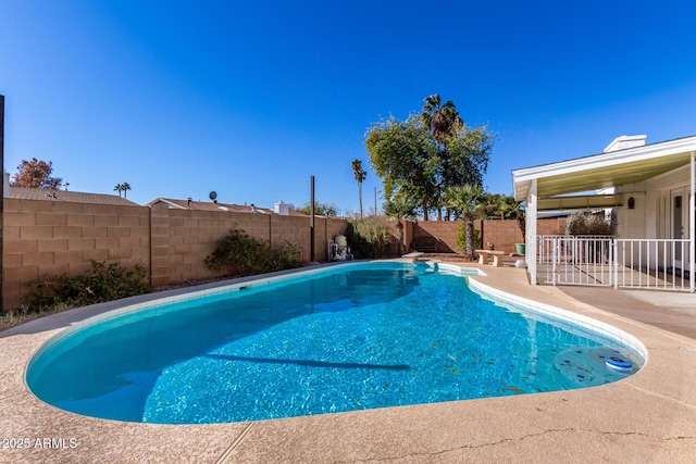 view of swimming pool with a patio