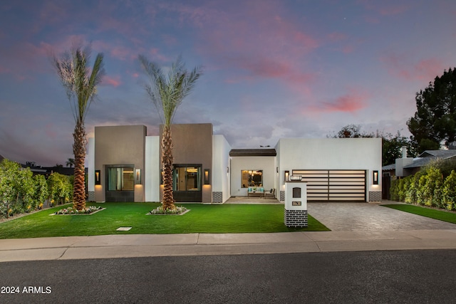 view of front of house with a yard