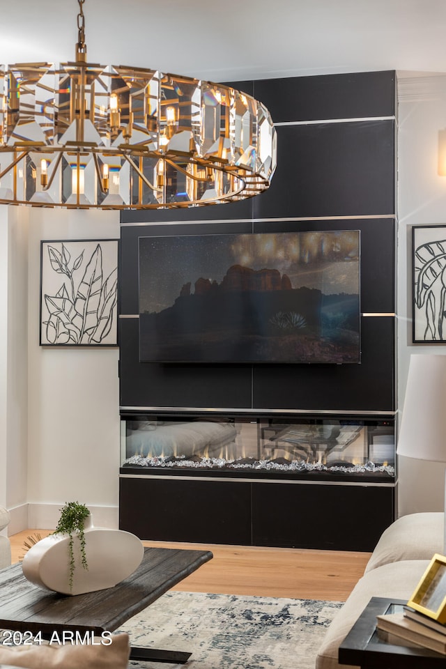 living room featuring a notable chandelier and hardwood / wood-style floors