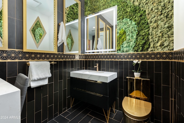 bathroom with tile walls and vanity