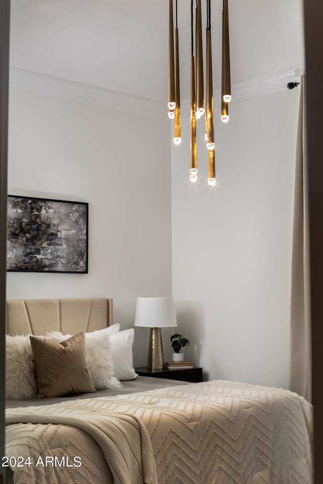 bedroom with ornamental molding