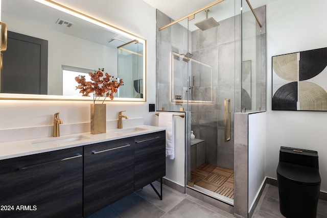 bathroom with vanity, an enclosed shower, and tile patterned floors