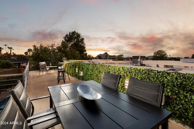 view of patio terrace at dusk