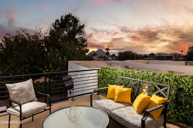 view of balcony at dusk