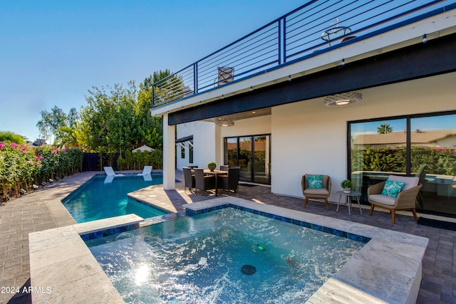 view of swimming pool with a patio