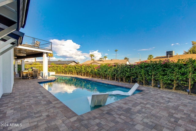 view of swimming pool featuring a patio area