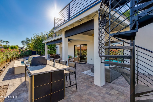 view of patio / terrace featuring an outdoor living space, a balcony, and area for grilling