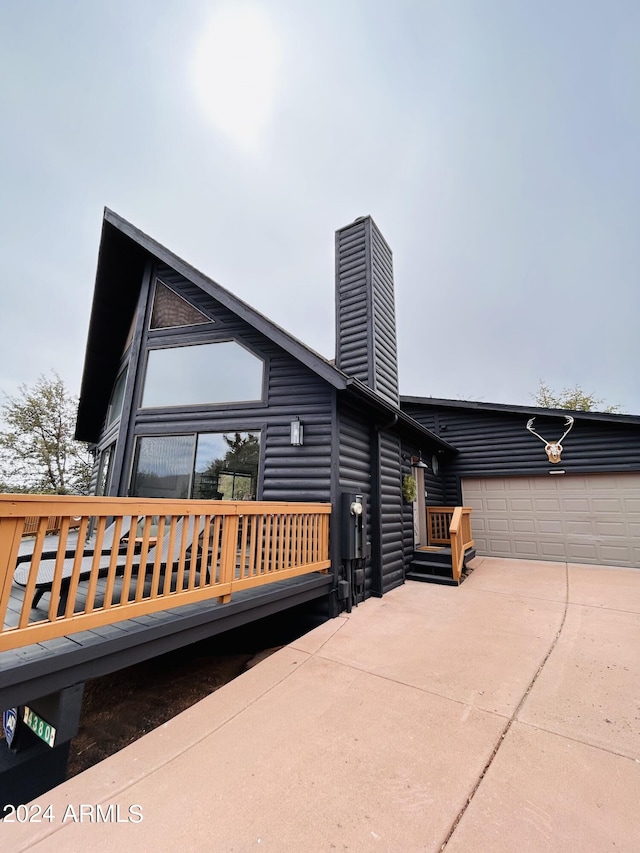 view of side of home with a garage