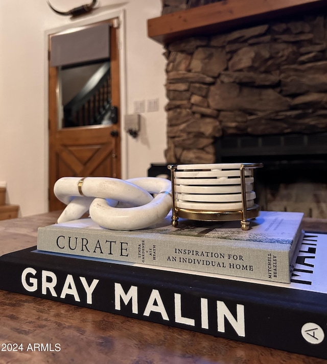 interior details featuring a fireplace and dark hardwood / wood-style floors