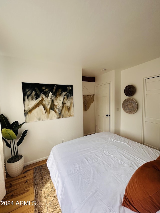 bedroom featuring hardwood / wood-style floors