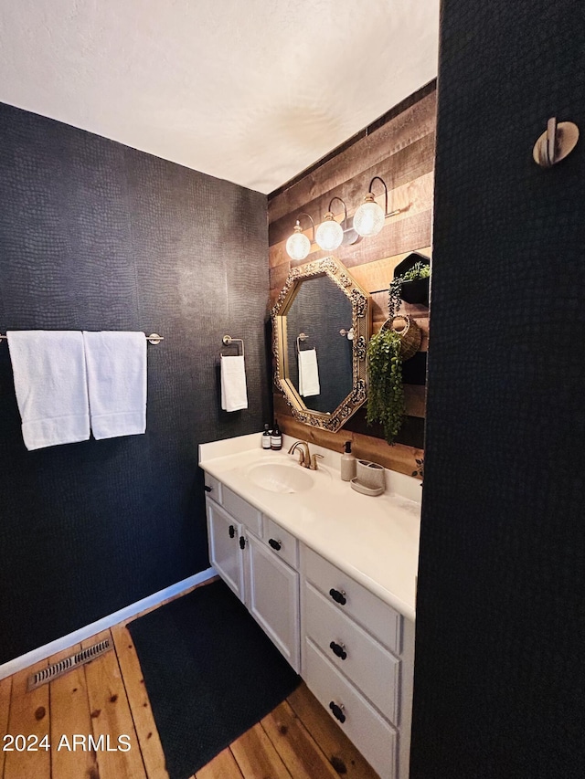 bathroom featuring hardwood / wood-style floors and vanity