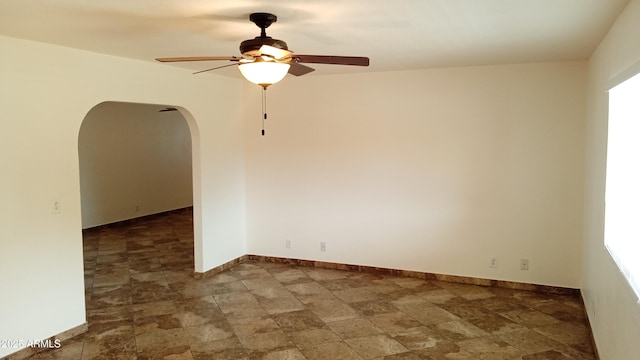 unfurnished room with ceiling fan