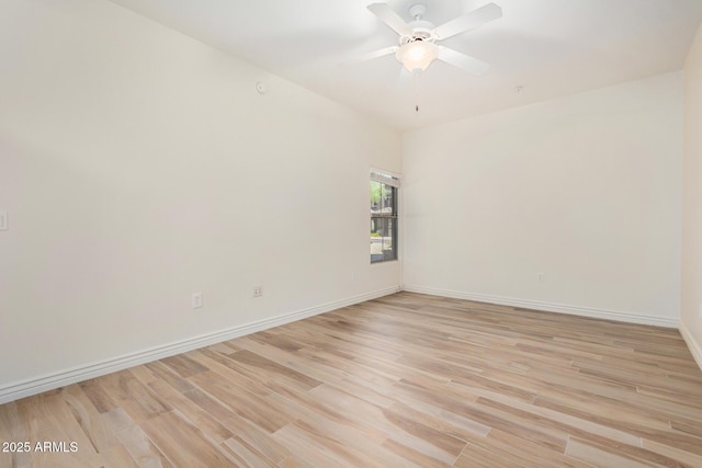 5450 E Deer Valley Dr Unit 1211, Phoenix, AZ 85054 - spare room featuring light wood-style flooring and ceiling fan