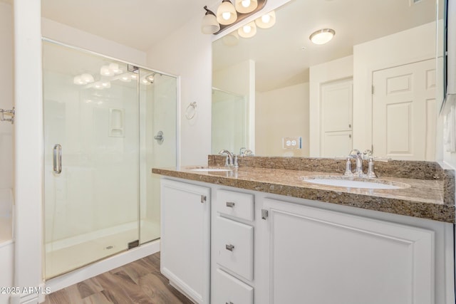 5450 E Deer Valley Dr Unit 1211, Phoenix, AZ 85054 - full bath with double vanity, a shower stall, and wood finished floors