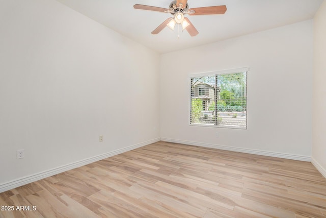 5450 E Deer Valley Dr Unit 1211, Phoenix, AZ 85054 - empty room featuring light wood-type flooring and a ceiling fan