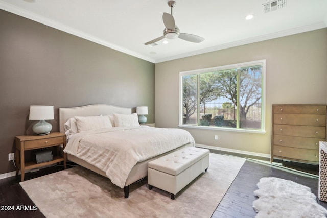 bedroom with wood-type flooring, ceiling fan, and crown molding