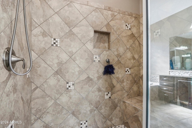 bathroom with tile walls and a tile shower