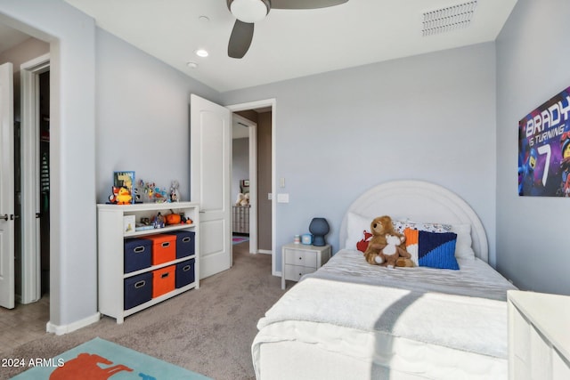 bedroom with ceiling fan and carpet flooring