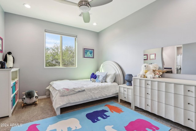 bedroom with ceiling fan and dark colored carpet