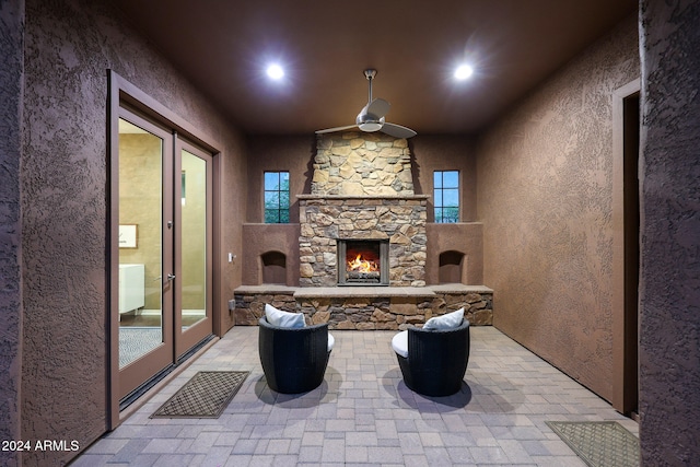 view of patio / terrace featuring an outdoor stone fireplace