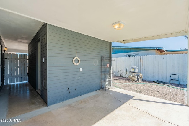 view of patio / terrace featuring fence