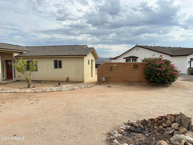 view of side of home featuring a patio area