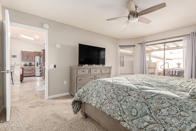 bedroom with baseboards, ceiling fan, light colored carpet, and stainless steel fridge with ice dispenser