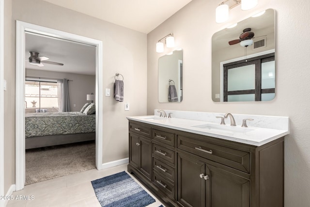 ensuite bathroom with a ceiling fan, a sink, and ensuite bathroom