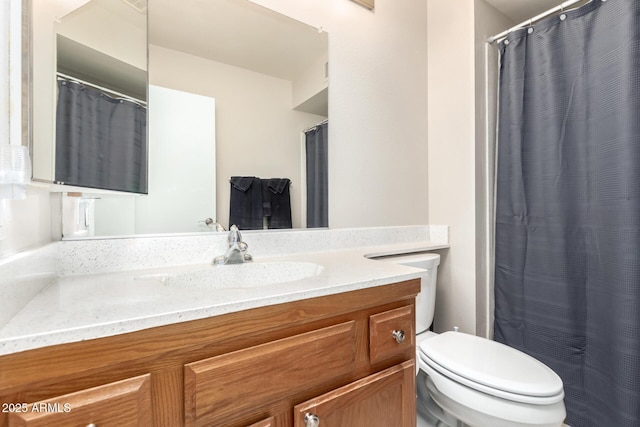 full bath featuring toilet and vanity