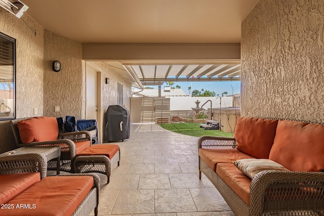 view of patio / terrace featuring an outdoor living space and grilling area