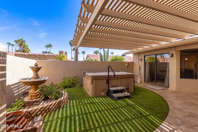 view of yard with a patio area, a fenced backyard, and a hot tub