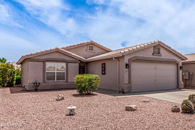 1395 E Runaway Bay Dr, Chandler, AZ 85249 - view of front of home with concrete driveway, an attached garage, stucco siding, and a tile roof