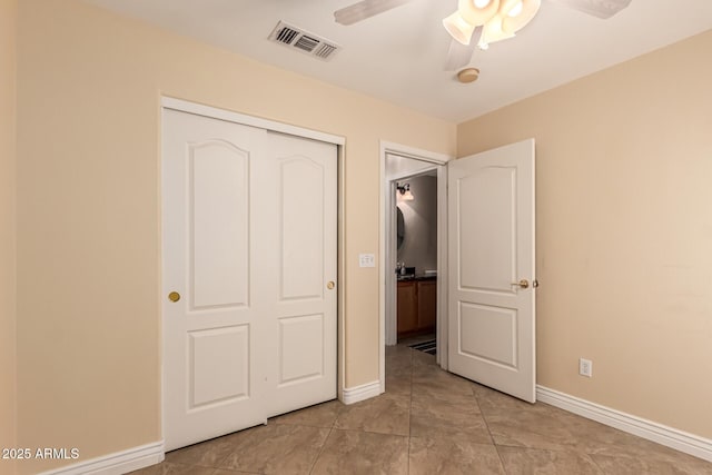 1395 E Runaway Bay Dr, Chandler, AZ 85249 - unfurnished bedroom with baseboards, a closet, and ceiling fan