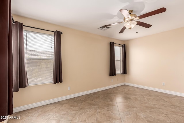 1395 E Runaway Bay Dr, Chandler, AZ 85249 - empty room with a ceiling fan, baseboards, and light tile patterned floors