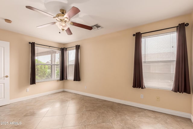 1395 E Runaway Bay Dr, Chandler, AZ 85249 - empty room with ceiling fan, baseboards, light tile patterned floors, and a smoke detector