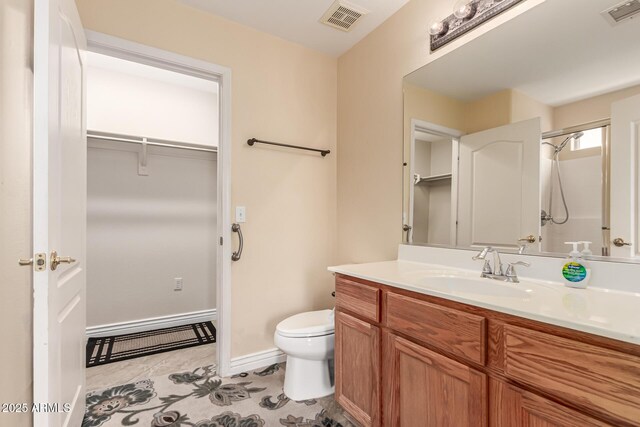 1395 E Runaway Bay Dr, Chandler, AZ 85249 - bathroom with vanity, toilet, a shower, a walk in closet, and baseboards