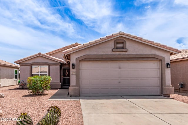 1395 E Runaway Bay Dr, Chandler, AZ 85249 - view of front of property featuring driveway, a garage, a tiled roof, and stucco siding