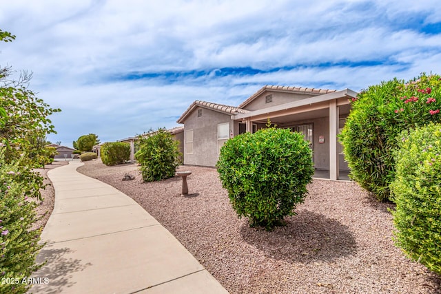 1395 E Runaway Bay Dr, Chandler, AZ 85249 - view of property exterior with stucco siding and a tiled roof
