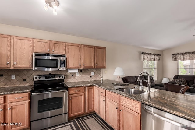 1395 E Runaway Bay Dr, Chandler, AZ 85249 - kitchen with appliances with stainless steel finishes, a sink, open floor plan, and tasteful backsplash