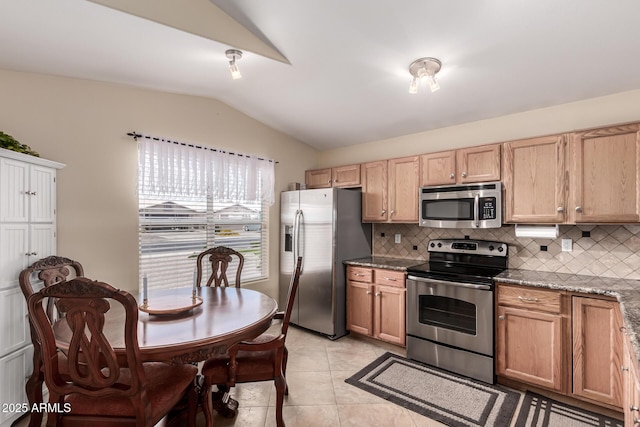 1395 E Runaway Bay Dr, Chandler, AZ 85249 - kitchen featuring stainless steel appliances, lofted ceiling, backsplash, light tile patterned floors, and light brown cabinets