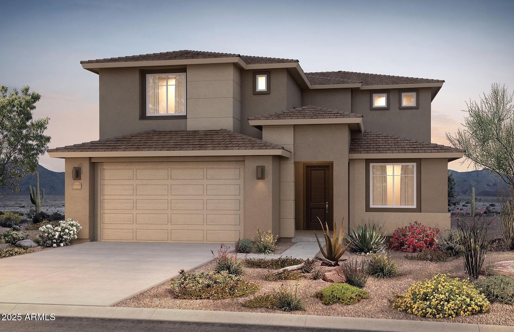 view of front facade featuring a mountain view and a garage